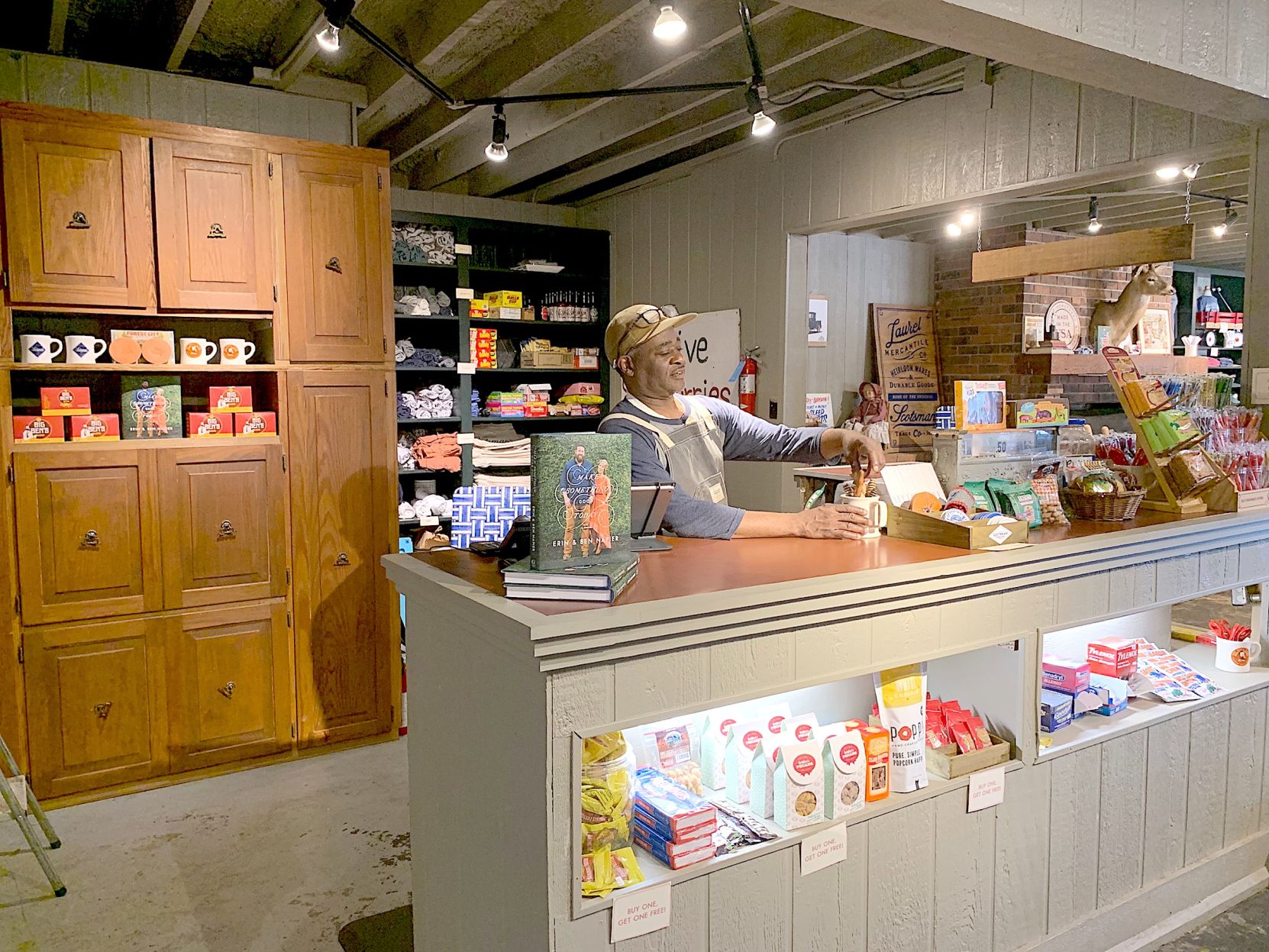 Store manager Gary Roberts behind the counter. (Photo by Tori Ellis).jpg